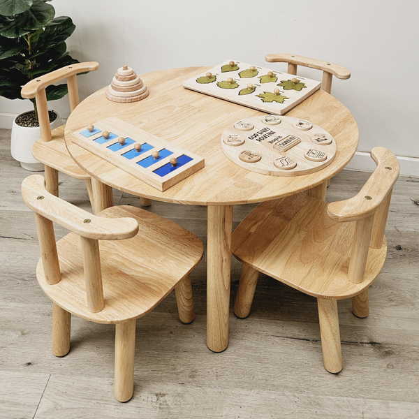 A Round Table And 4 Chairs Dining Tables